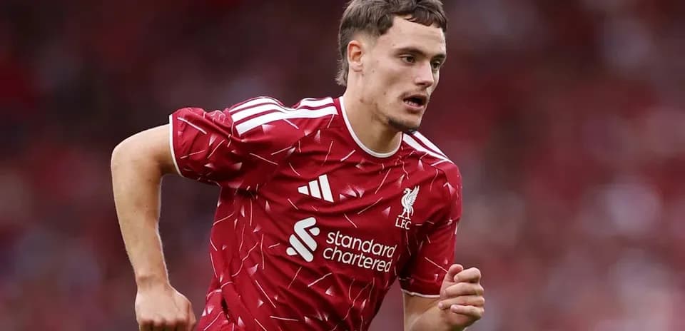 Player running on field in Liverpool kit