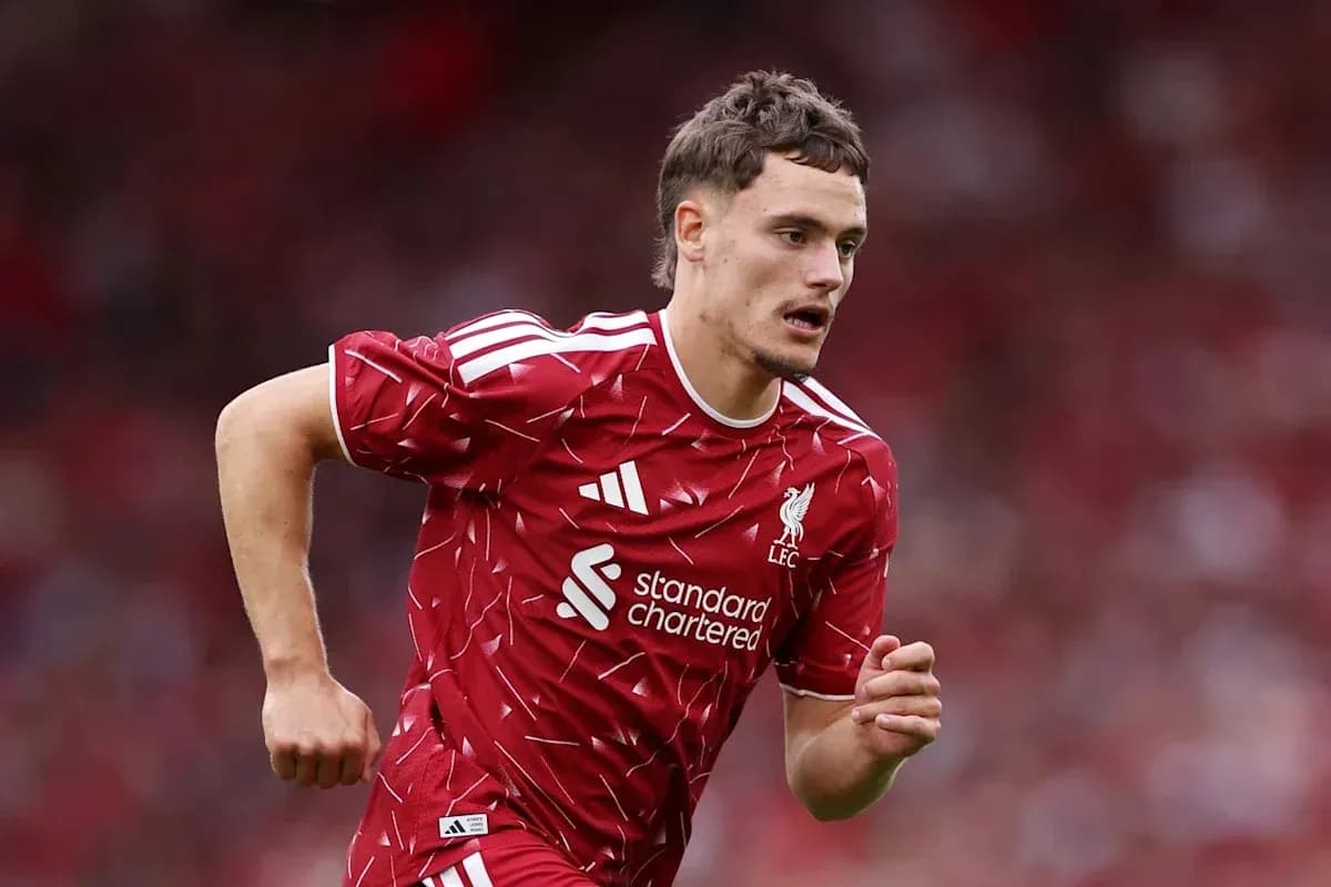 Player running on field in Liverpool kit