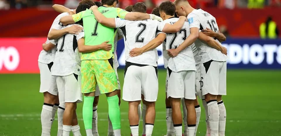 Team huddled together before the match