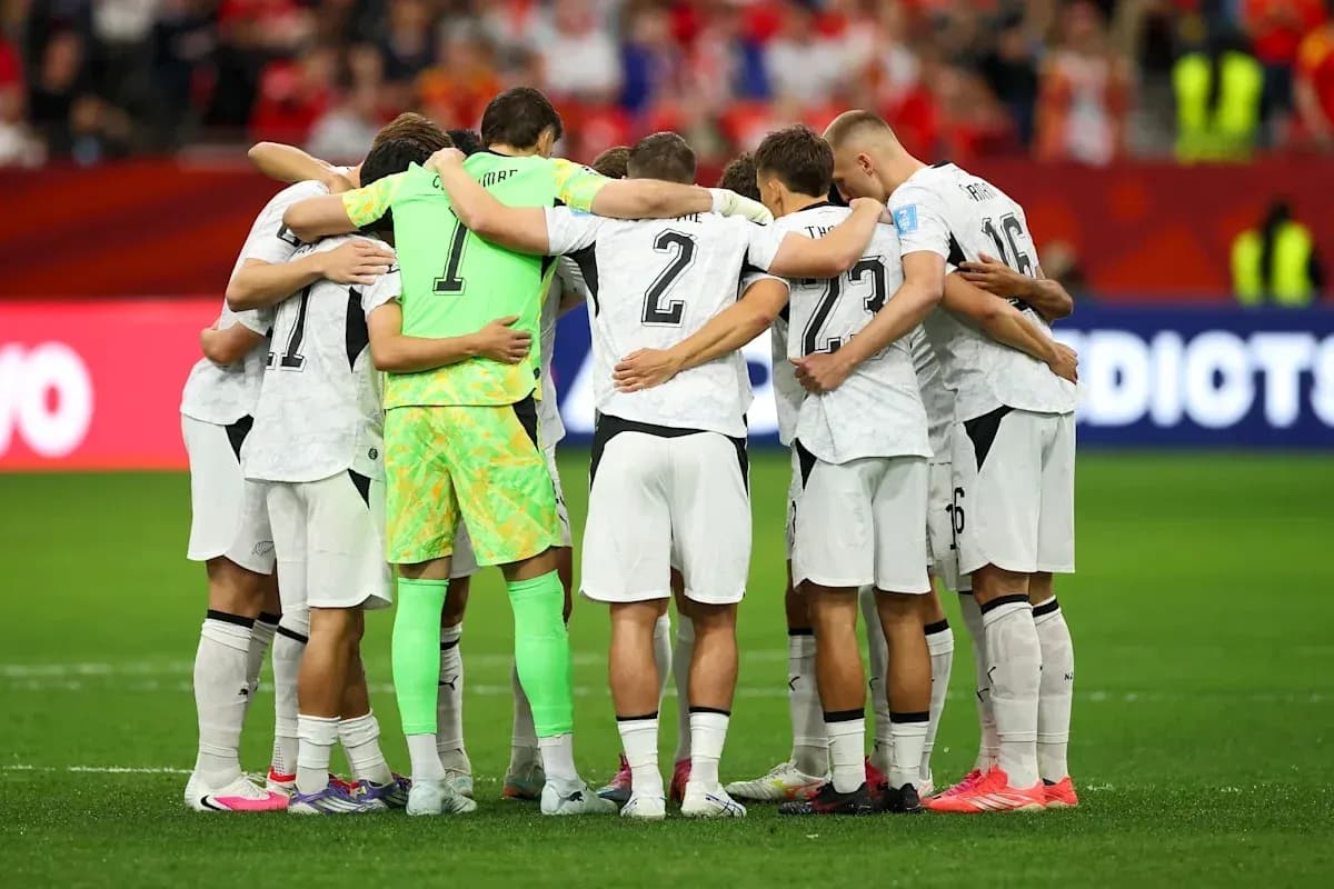 Team huddled together before the match