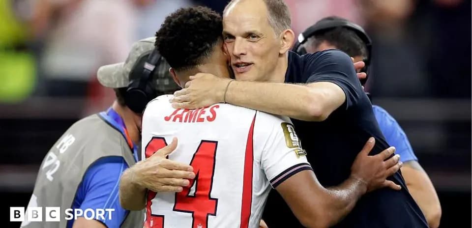 Player and coach embracing after match celebration