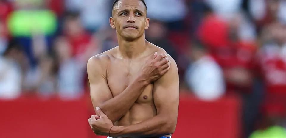 Player with no shirt standing on the field