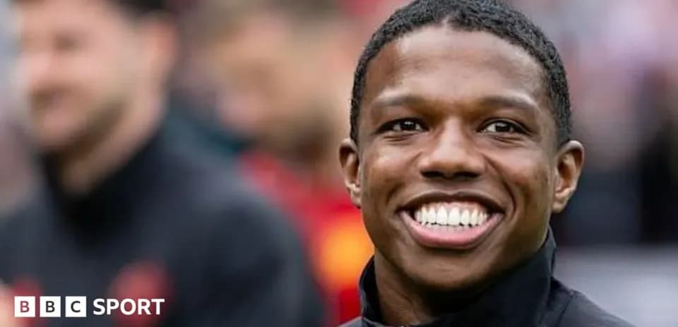 Player smiling during pre-match warm-up