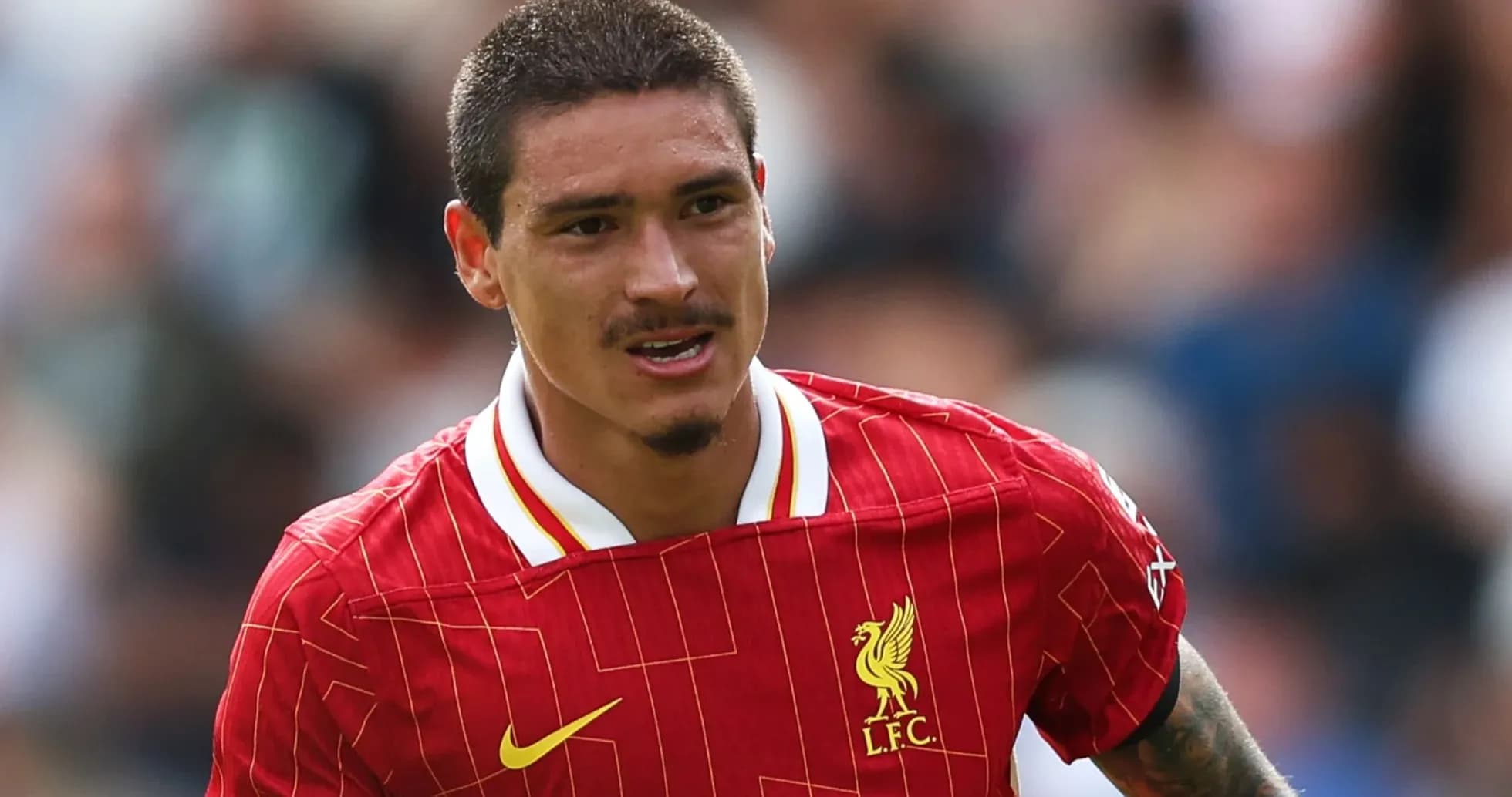 Player wearing Liverpool jersey during a match