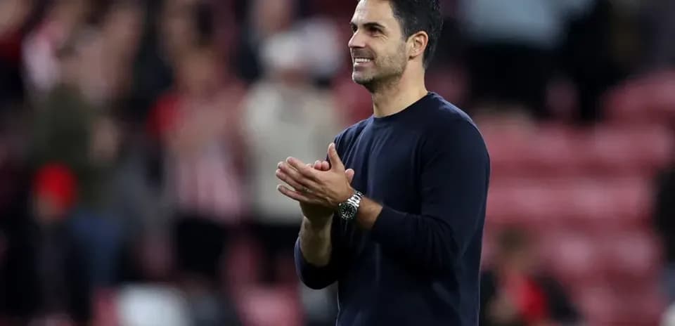 Manager applauding fans after match at stadium