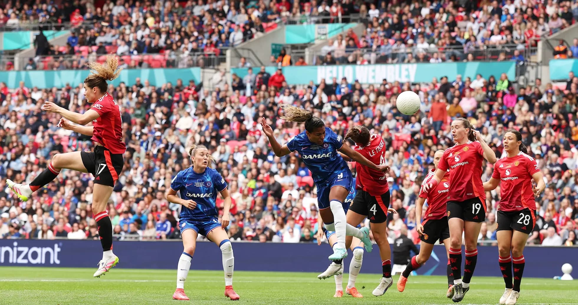 Chelsea player heading the ball during match