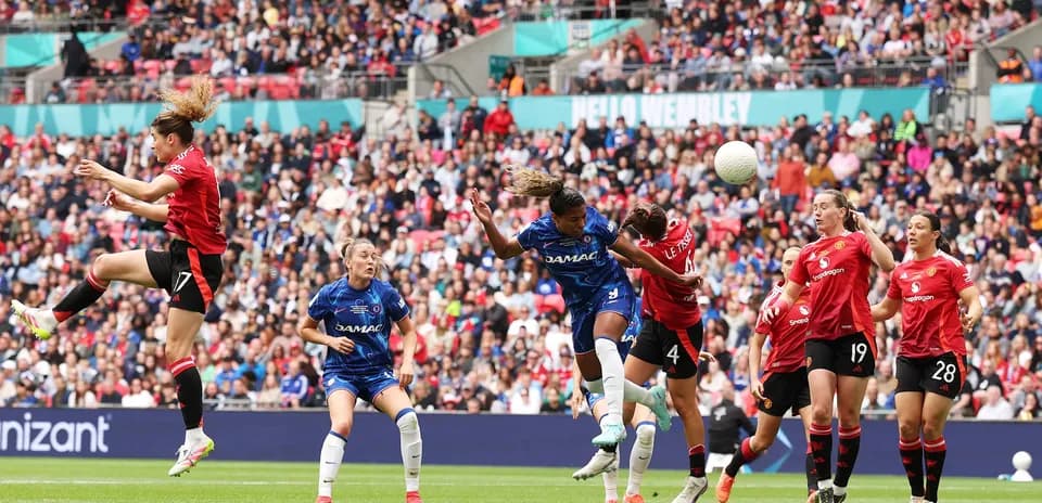 Chelsea player heading the ball during match