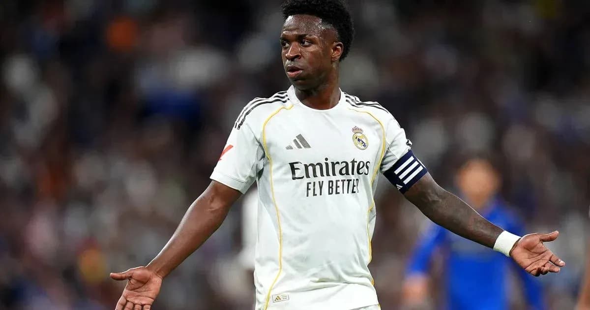 Player gesturing during a match wearing Real Madrid kit