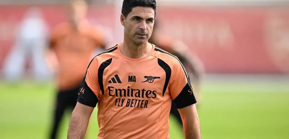 Coach in training kit at Arsenal training session