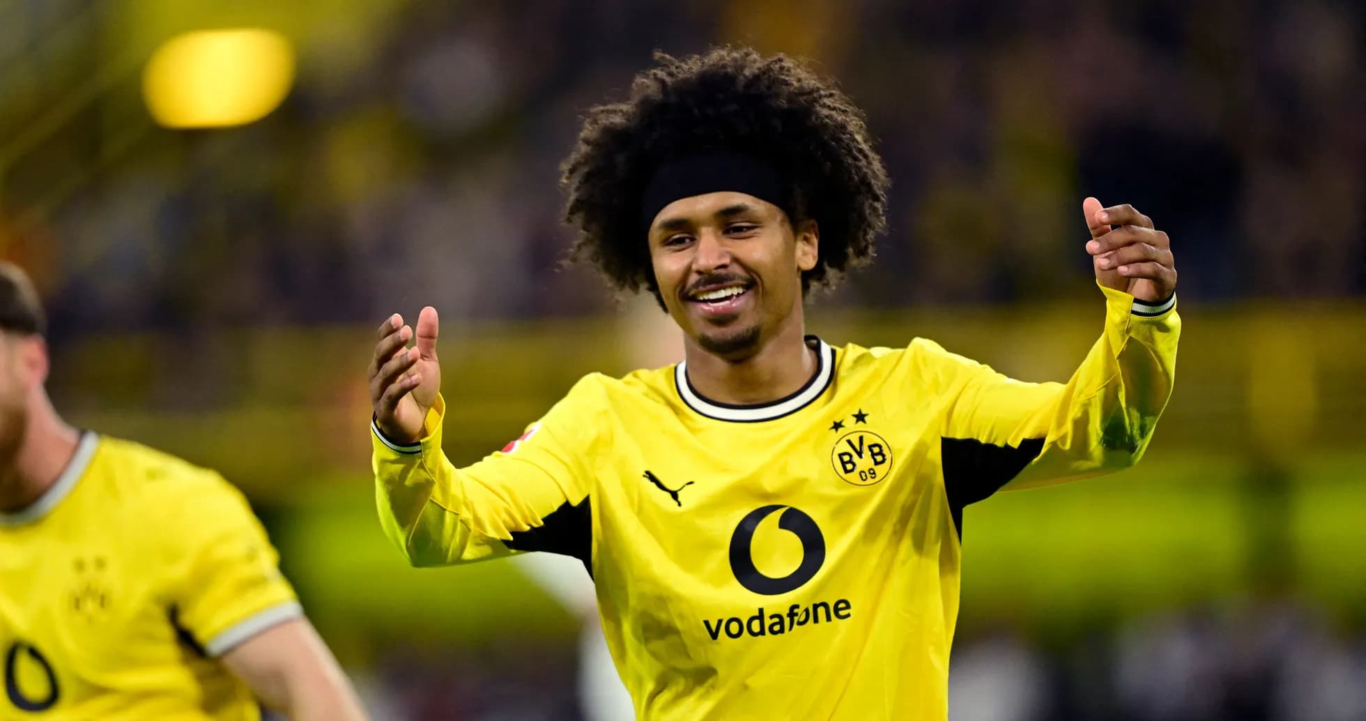Player celebrating after scoring a goal for Dortmund
