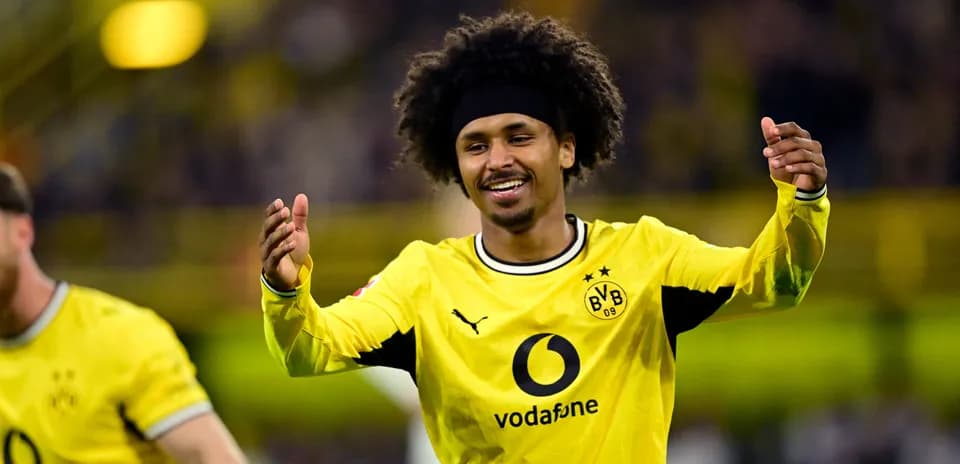 Player celebrating after scoring a goal for Dortmund