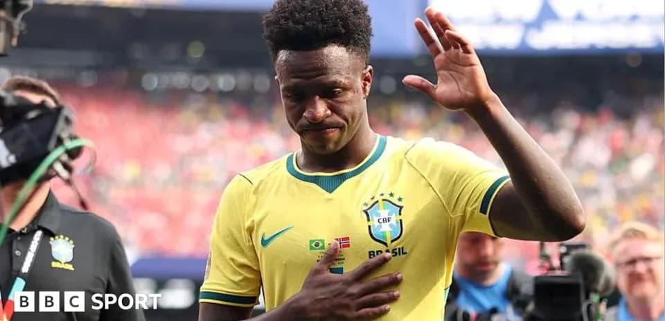 Player waving while walking off the pitch