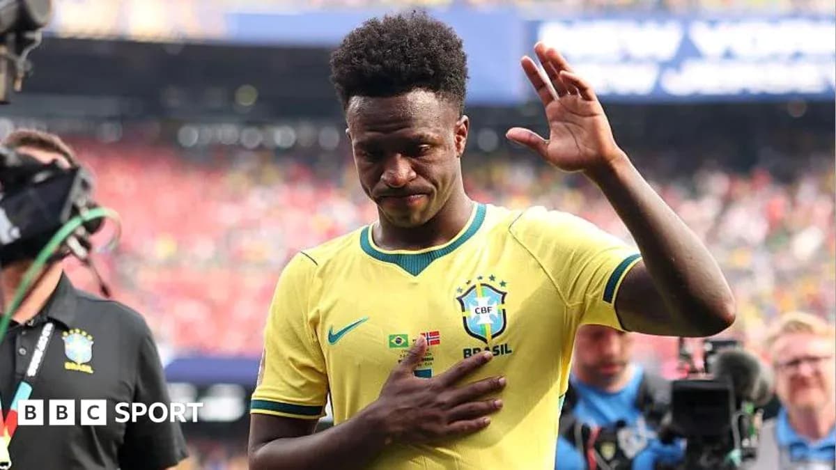 Player waving while walking off the pitch