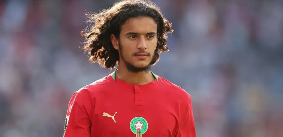 Player wearing red Morocco jersey on the field