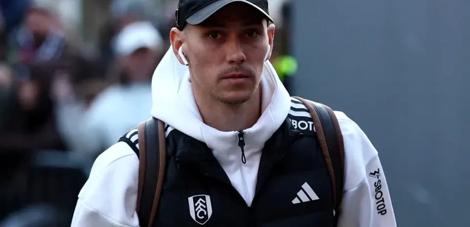 Player walking with headphones before match