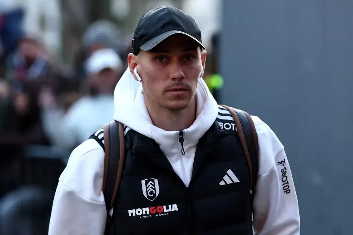Player walking with headphones before match