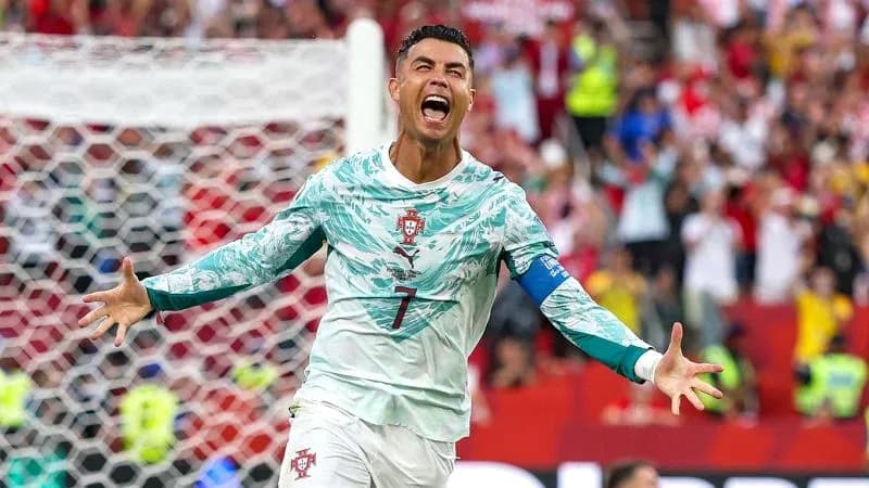 Player celebrating after scoring a goal for Portugal