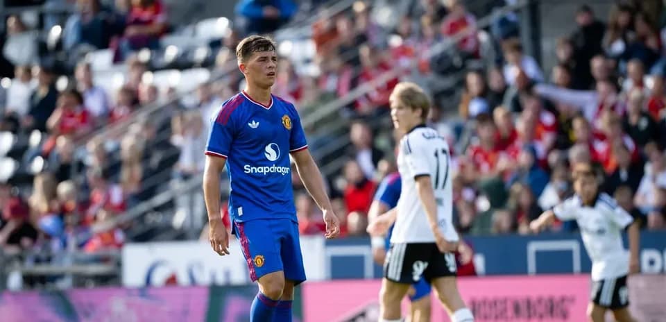 Player in blue jersey on field during match