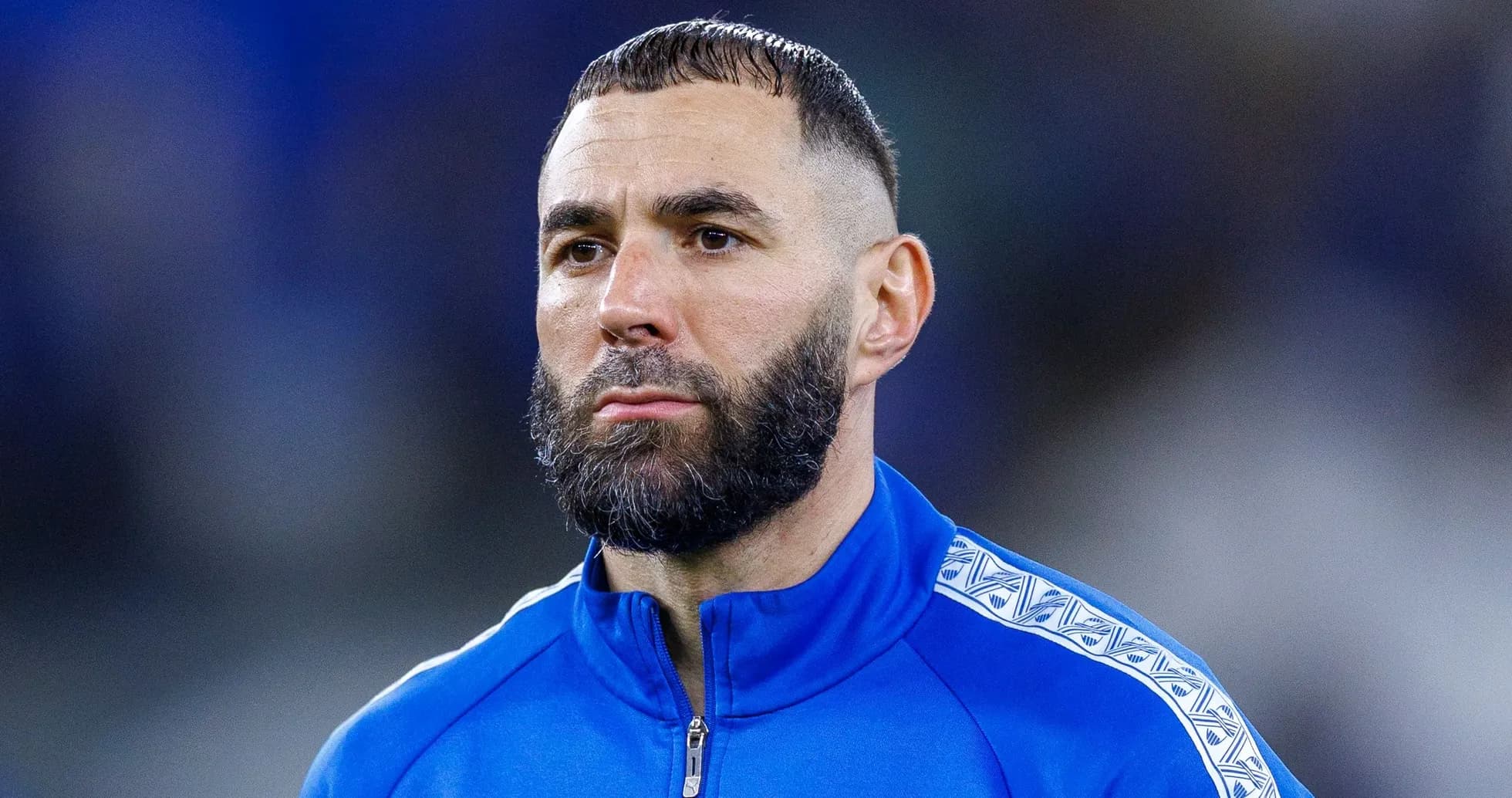 Player in blue tracksuit on the field