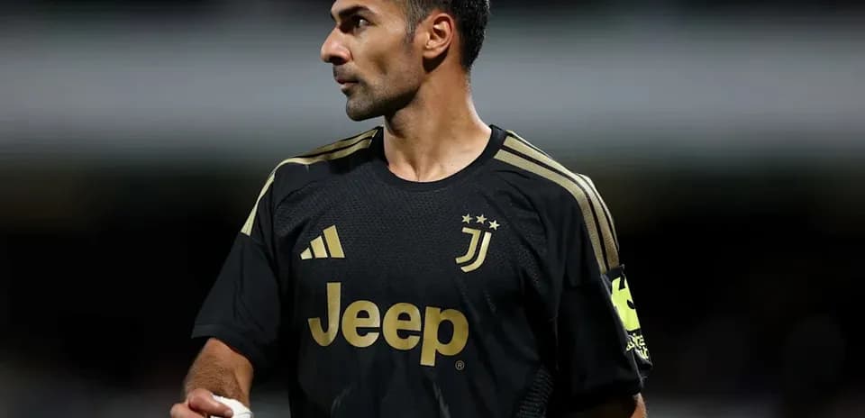 Player in Juventus kit during match warm-up