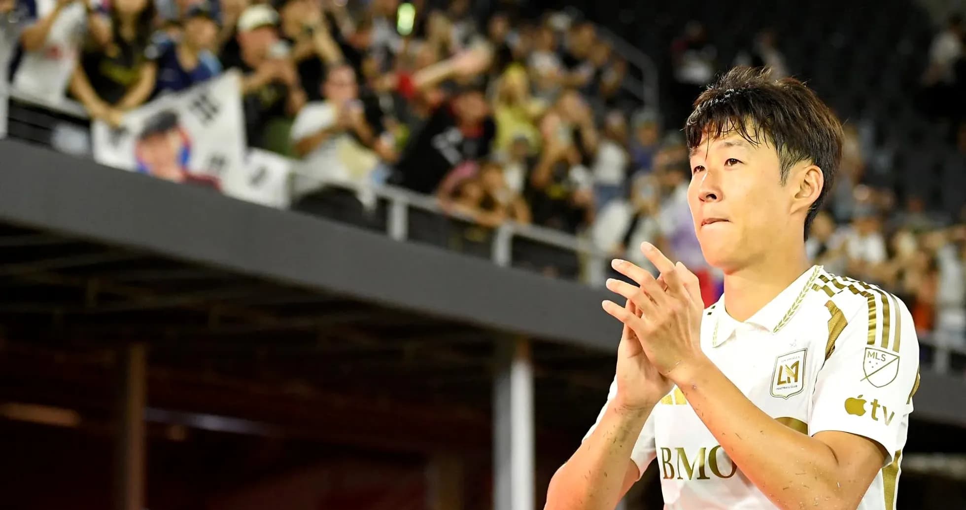 Player applauding fans after the match