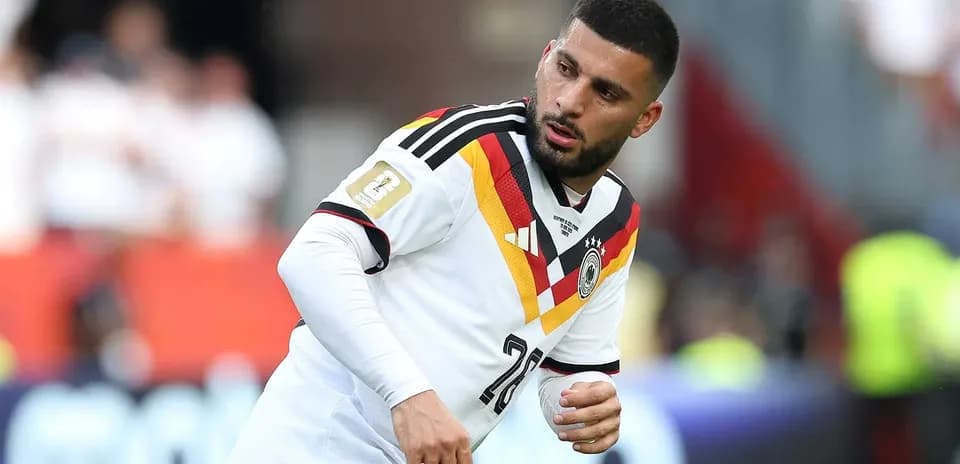 Player wearing Germany jersey during warm-up on field
