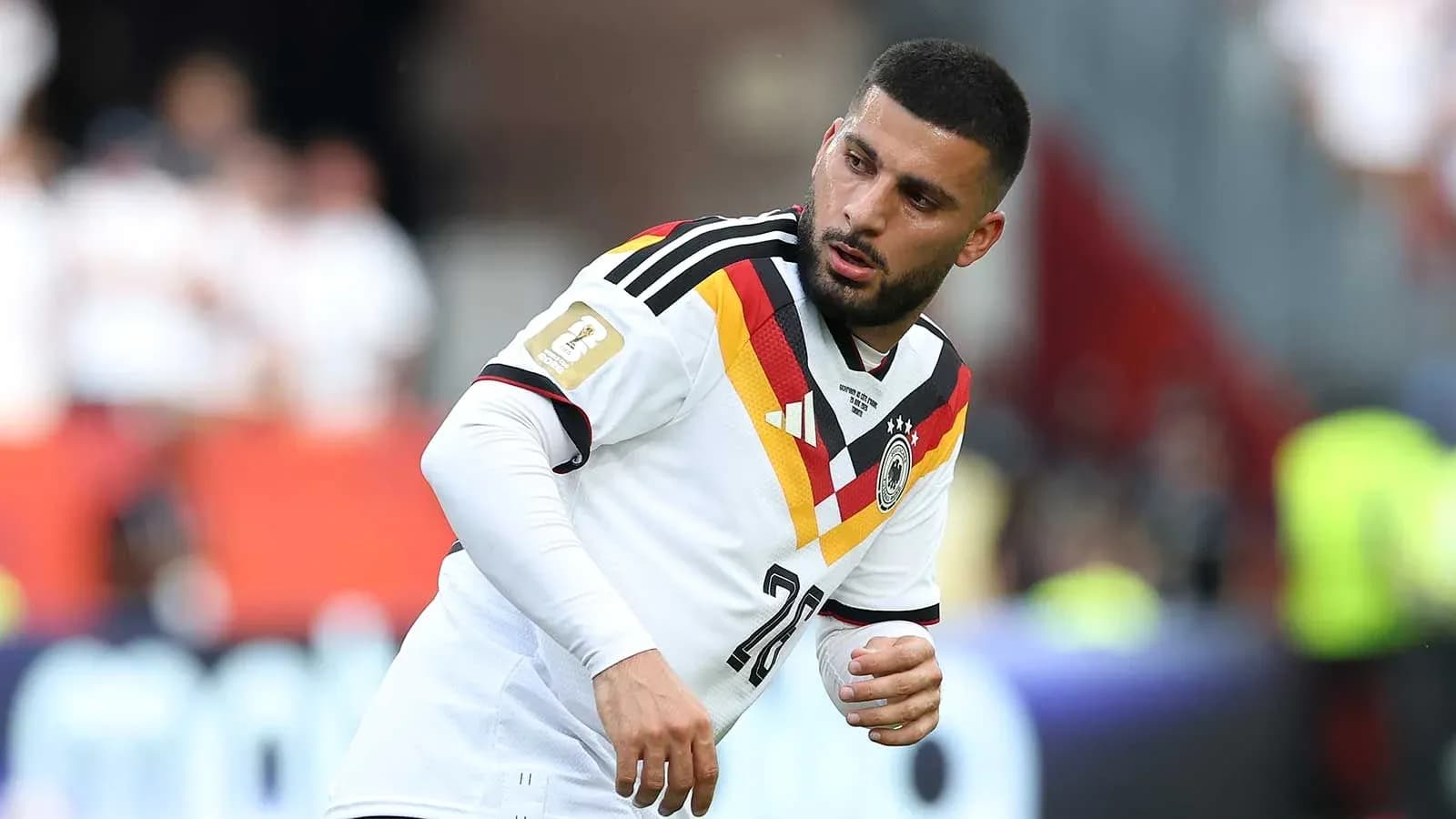 Player wearing Germany jersey during warm-up on field