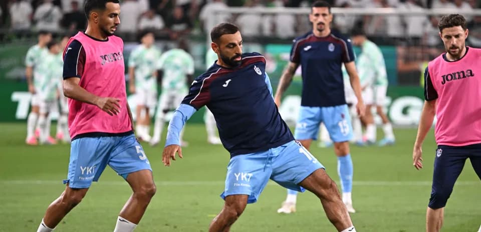 Players warming up on field before match
