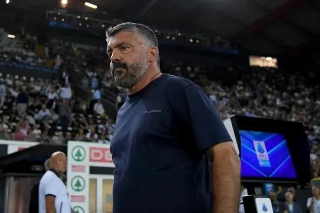 Coach standing on sidelines during match