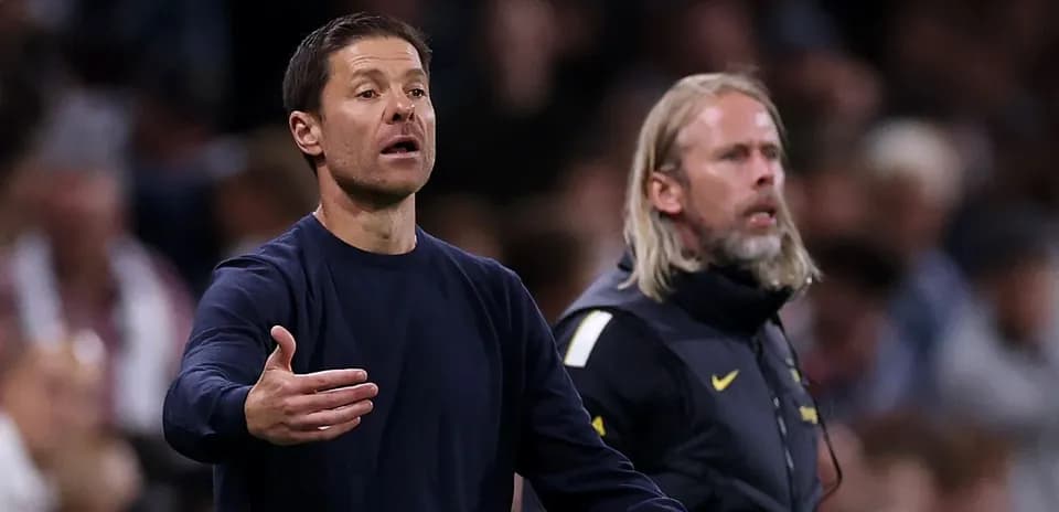 Coaches gesturing during a match from the sidelines