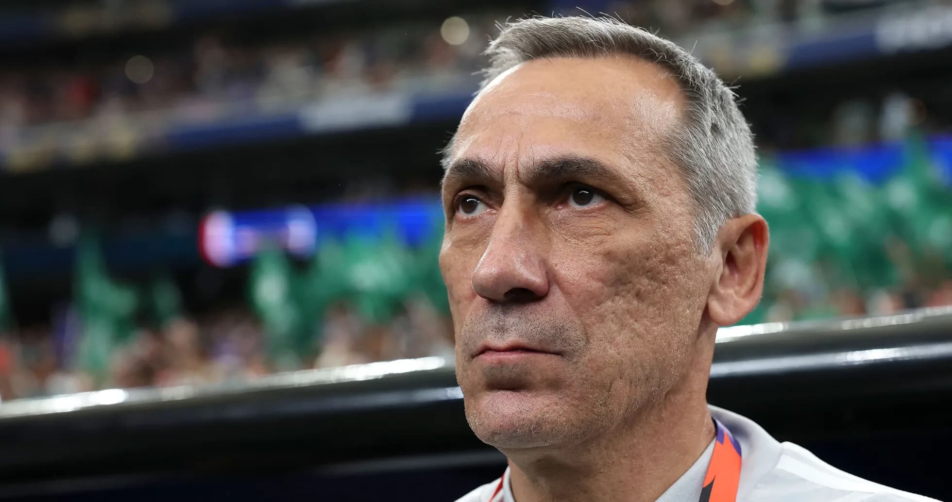 Coach focused during a match on the sidelines