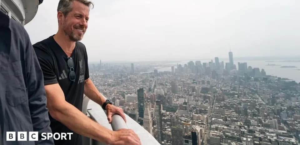 Person looking over New York City skyline from height