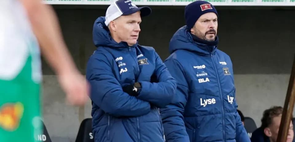 Coaches observing the game from the sidelines