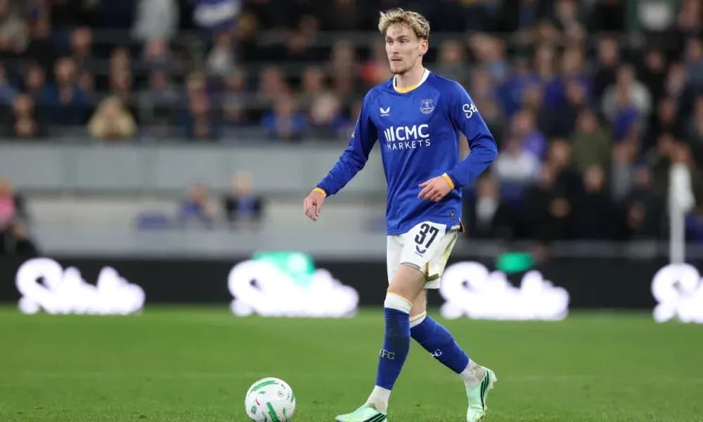 Player in blue jersey walking on the pitch