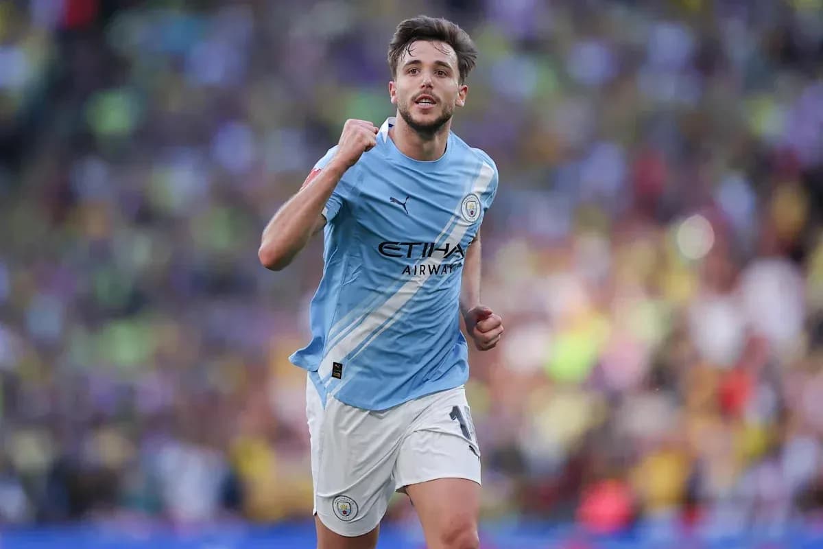 Player celebrating after scoring a goal for Manchester City
