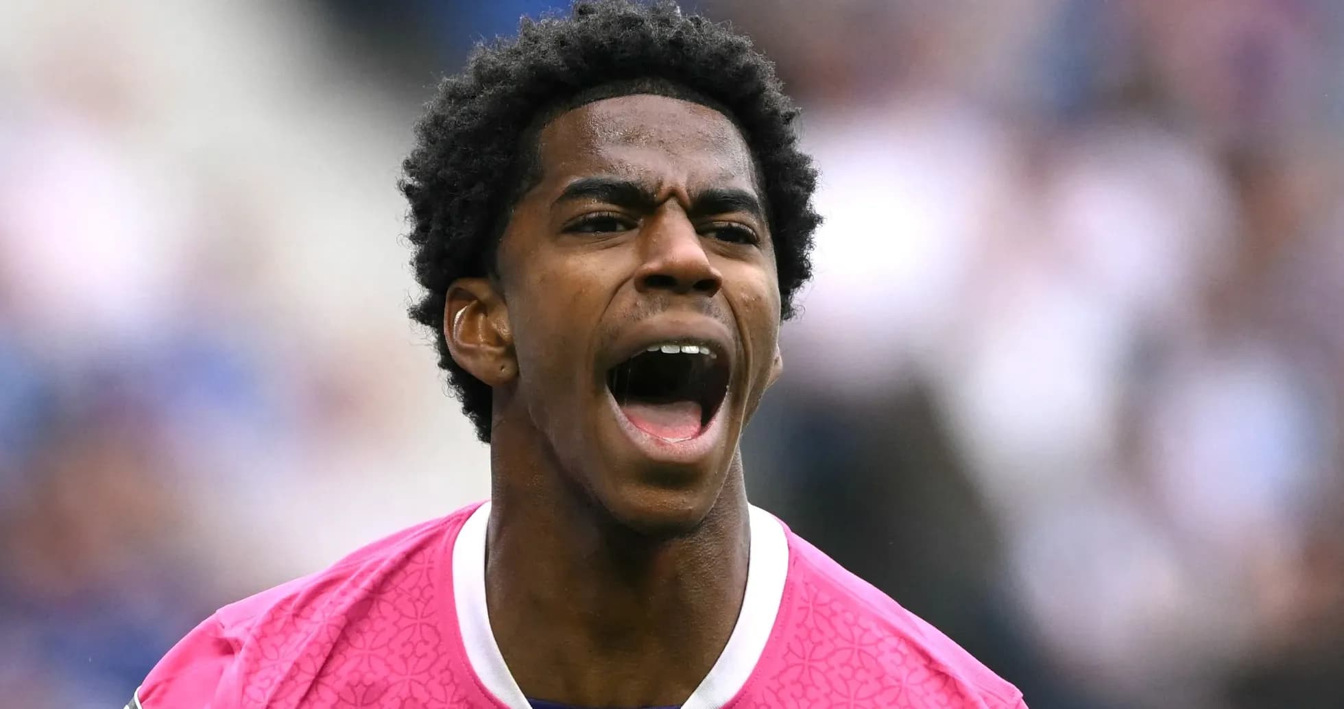 Player shouting during a football match celebration