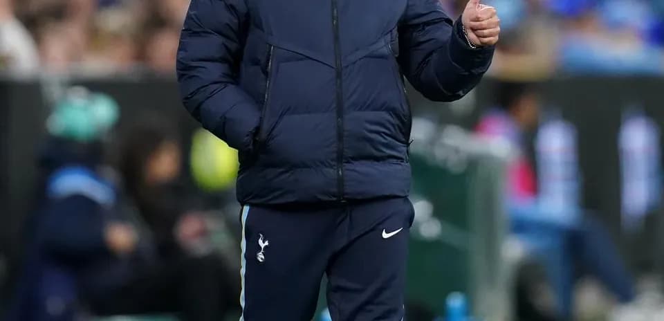 Manager walking on sideline giving thumbs up