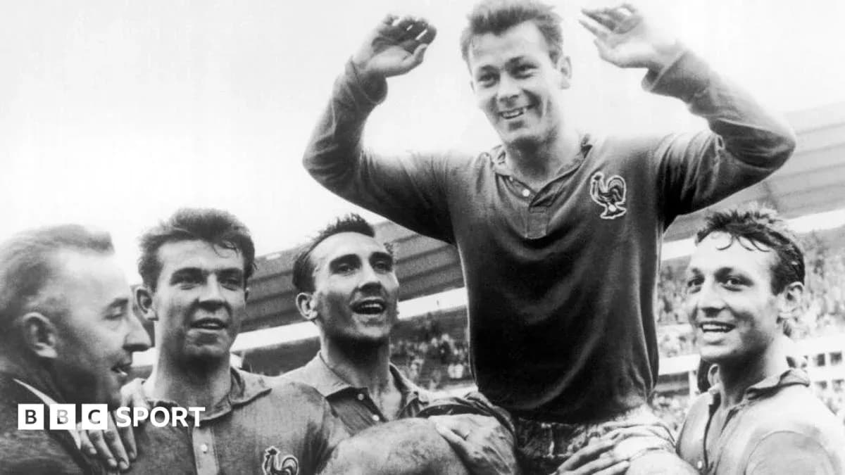 Players celebrating a victory with one lifted on shoulders