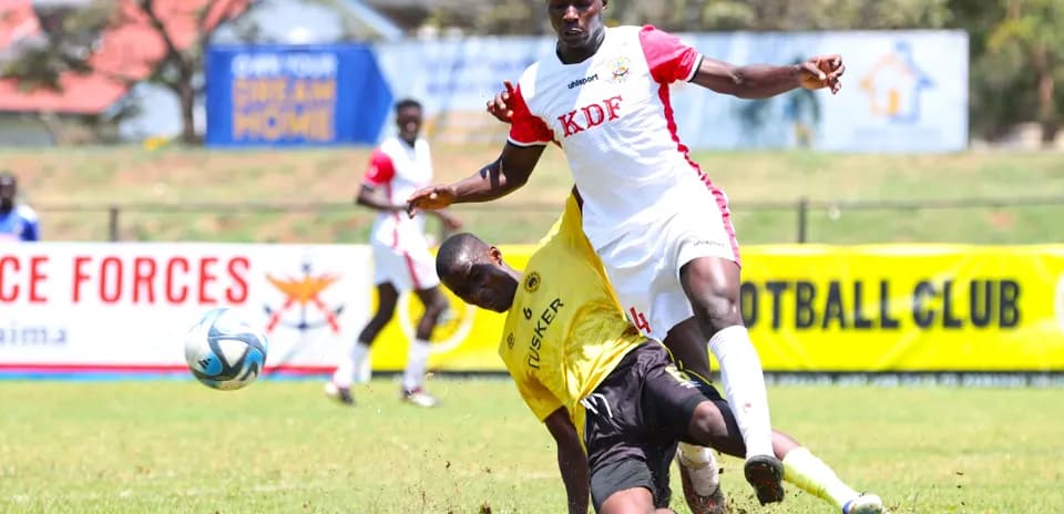 Player tackling opponent during Ulinzi Stars match