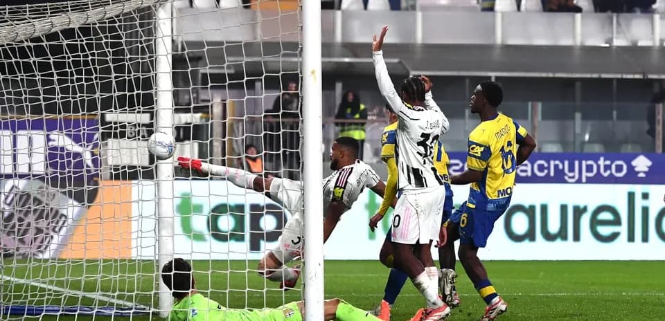 Goalkeeper attempting to save a shot on goal