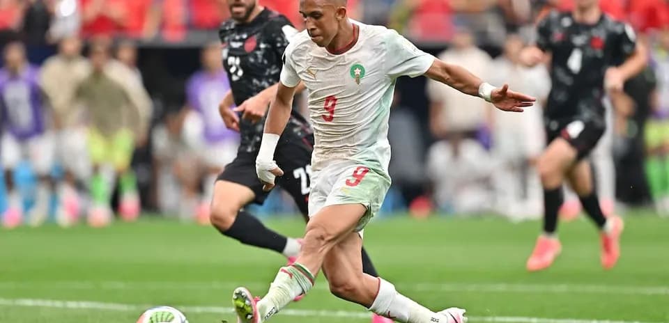 Moroccan player shooting at goal during match