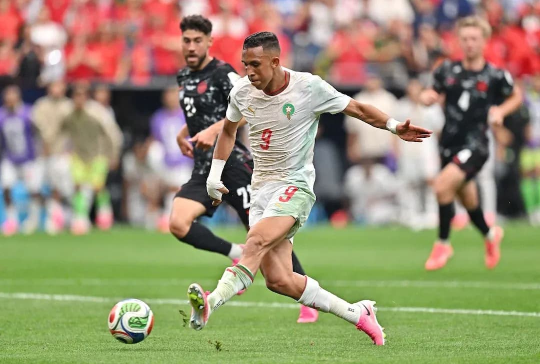 Moroccan player shooting at goal during match