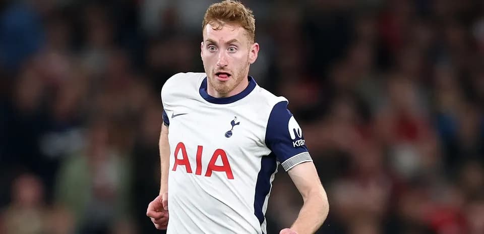 Player running on field in Tottenham kit