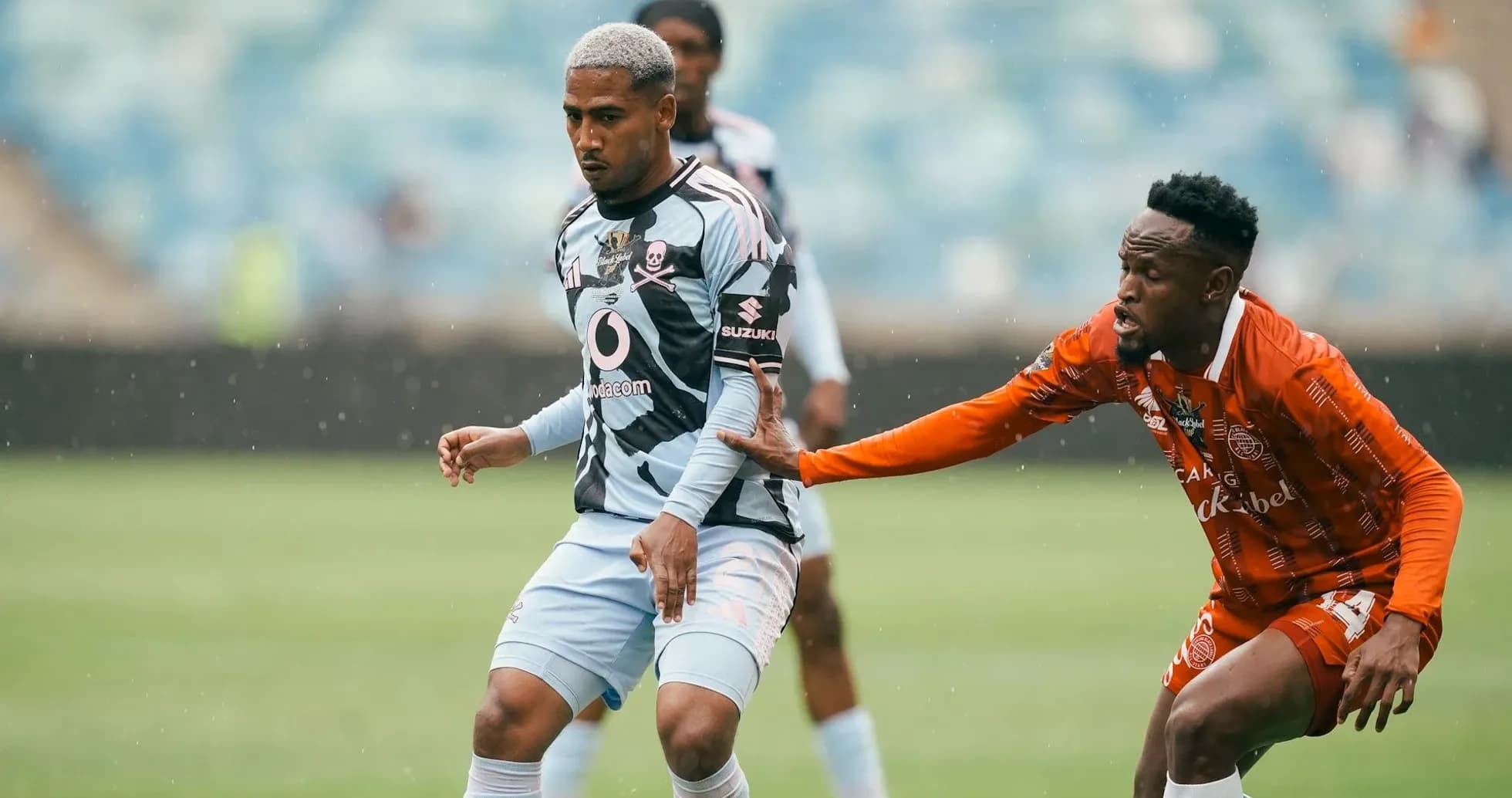 Player in striped jersey evading opponent during match