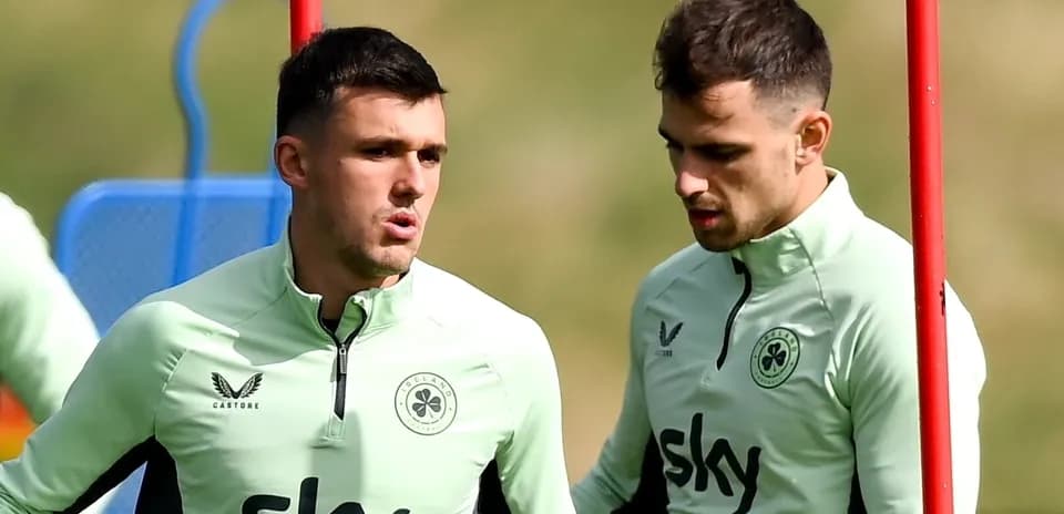 Two players talking during training session