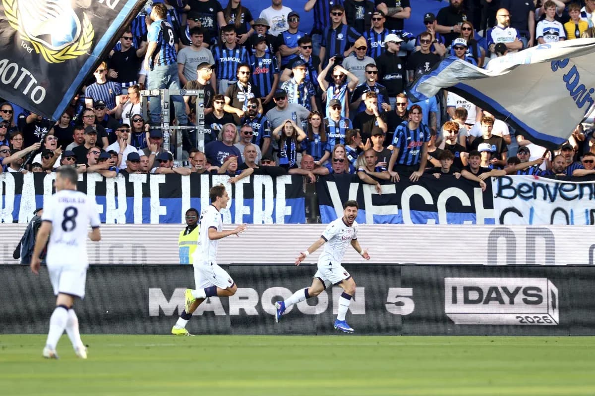 Players celebrating in front of Atalanta fans