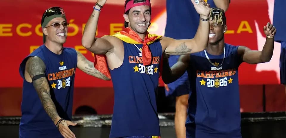 Players celebrating with medals and a flag