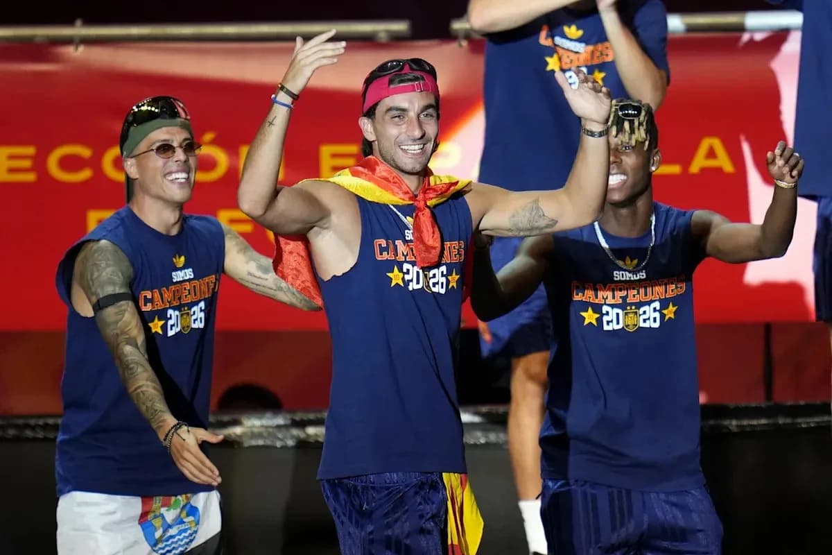 Players celebrating with medals and a flag