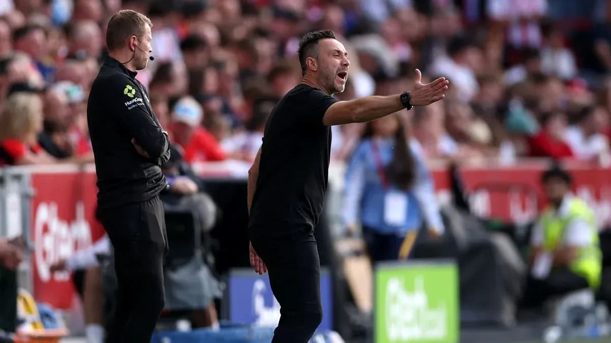 Coach gesturing on the sidelines during match