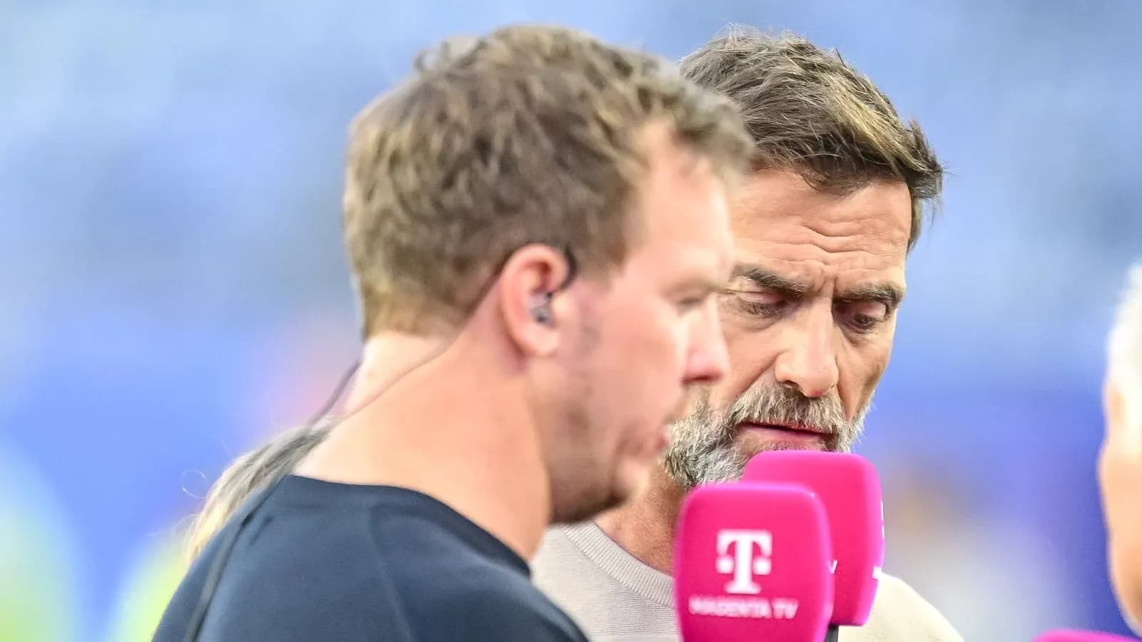 Two commentators discussing before a sports event